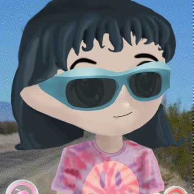 Shaw, in blue sunglasses and a pink tie-dye shirt.
